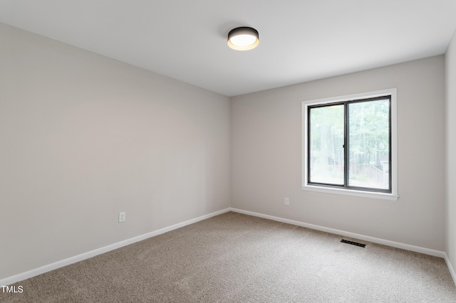 2905 Scuppernong Ln, Durham, NC 27703 - carpeted empty room featuring baseboards