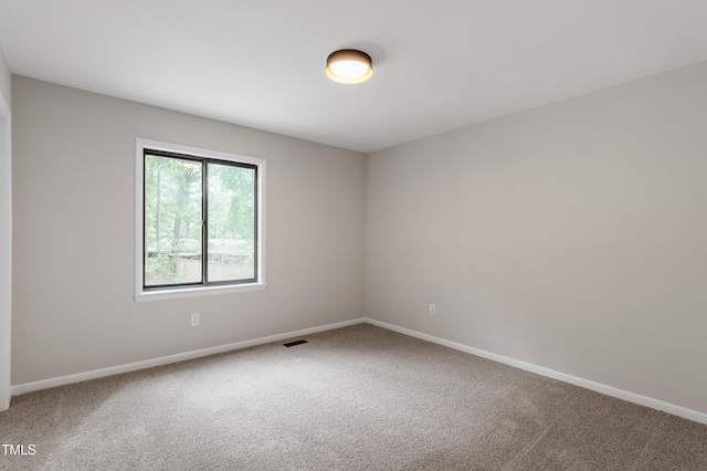2905 Scuppernong Ln, Durham, NC 27703 - spare room featuring carpet and baseboards