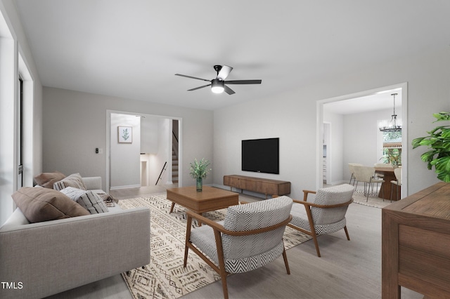 2905 Scuppernong Ln, Durham, NC 27703 - living area with stairs, light wood finished floors, and a ceiling fan