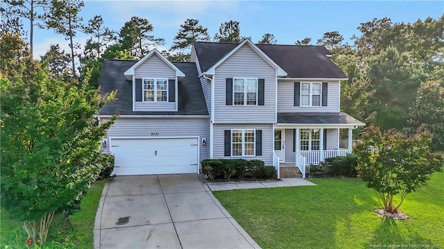 9031 Grouse Run Ln, Fayetteville, NC 28314 - traditional home featuring a porch, concrete driveway, an attached garage, and a front lawn