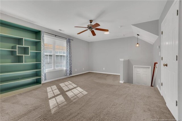 9031 Grouse Run Ln, Fayetteville, NC 28314 - unfurnished living room with carpet floors, ceiling fan, baseboards, and vaulted ceiling