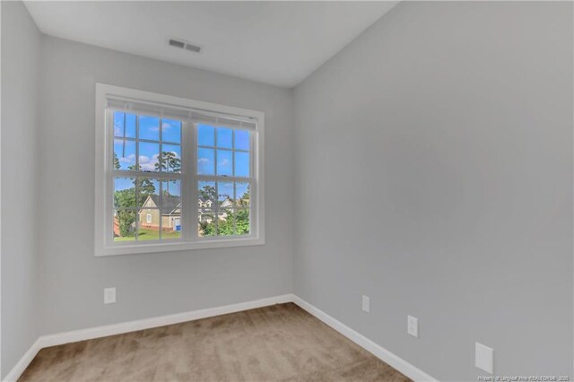 9031 Grouse Run Ln, Fayetteville, NC 28314 - spare room featuring baseboards and carpet floors