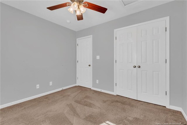 9031 Grouse Run Ln, Fayetteville, NC 28314 - unfurnished bedroom featuring carpet, baseboards, a ceiling fan, and a closet
