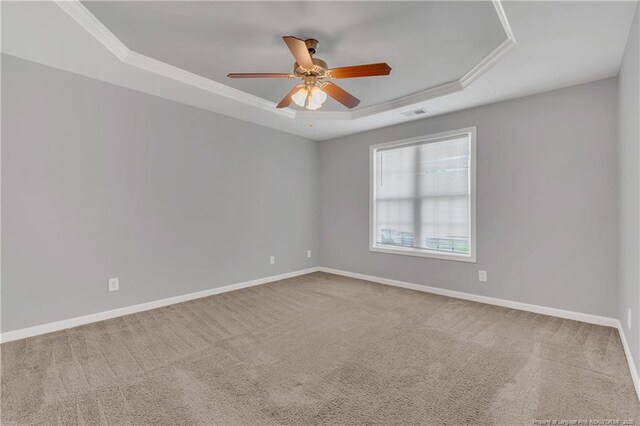 9031 Grouse Run Ln, Fayetteville, NC 28314 - spare room with a raised ceiling, ceiling fan, carpet, ornamental molding, and baseboards