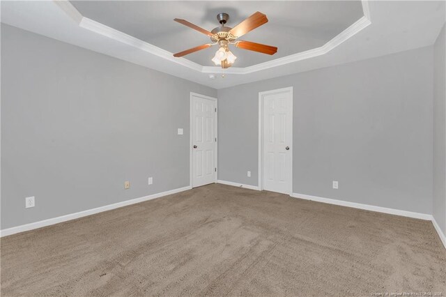 9031 Grouse Run Ln, Fayetteville, NC 28314 - empty room with a raised ceiling, ornamental molding, ceiling fan, carpet flooring, and baseboards