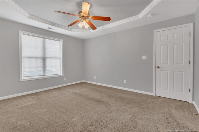 9031 Grouse Run Ln, Fayetteville, NC 28314 - carpeted spare room with a raised ceiling, ornamental molding, ceiling fan, baseboards, and a smoke detector