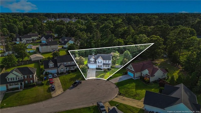 9031 Grouse Run Ln, Fayetteville, NC 28314 - aerial view of residential area with a heavily wooded area and property parcel outlined