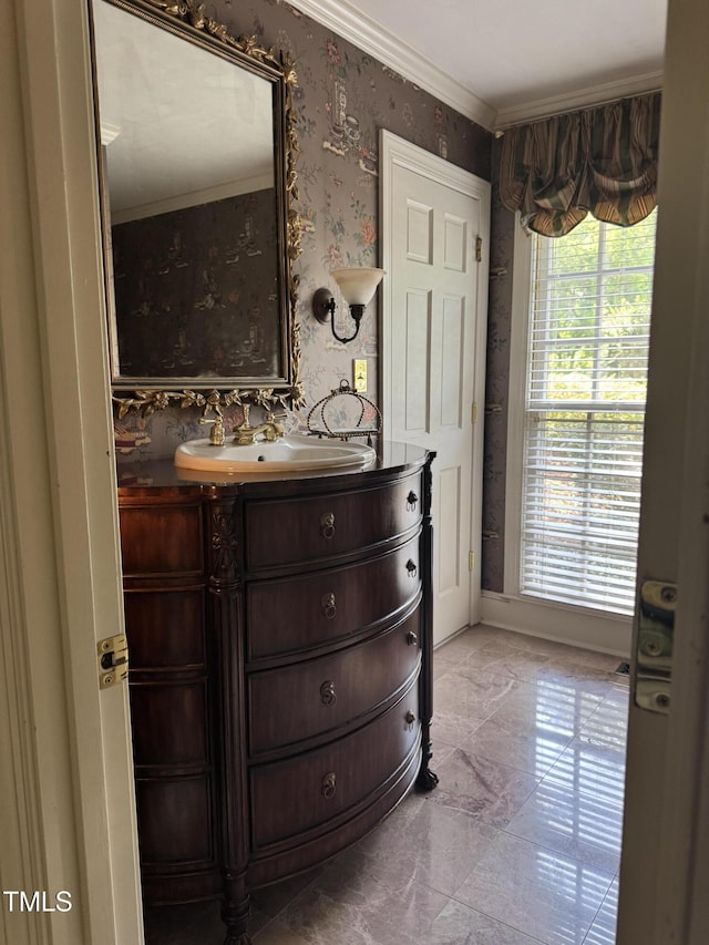 7140 N Ridge Dr, Raleigh, NC 27615 - bathroom featuring vanity, marble finish flooring, wallpapered walls, and crown molding