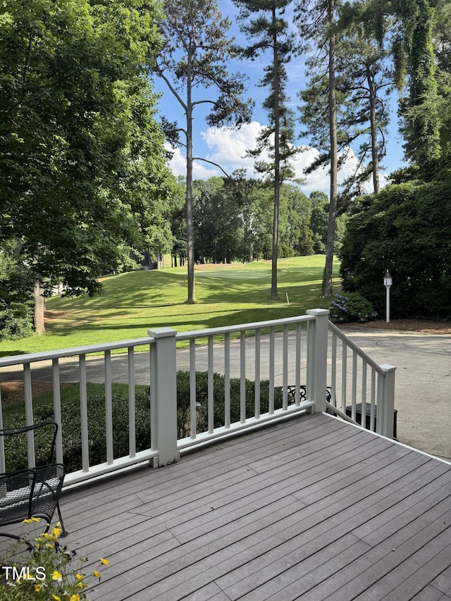 7140 N Ridge Dr, Raleigh, NC 27615 - deck featuring view of wooded area and a lawn