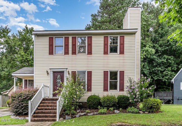 3605 Iron Sight Ct, Raleigh, NC 27616 - view of front facade with a chimney and a front lawn