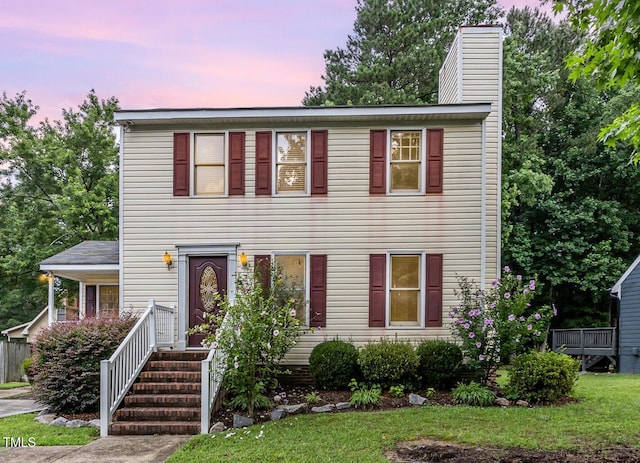 3605 Iron Sight Ct, Raleigh, NC 27616 - view of front facade with a chimney and a front lawn
