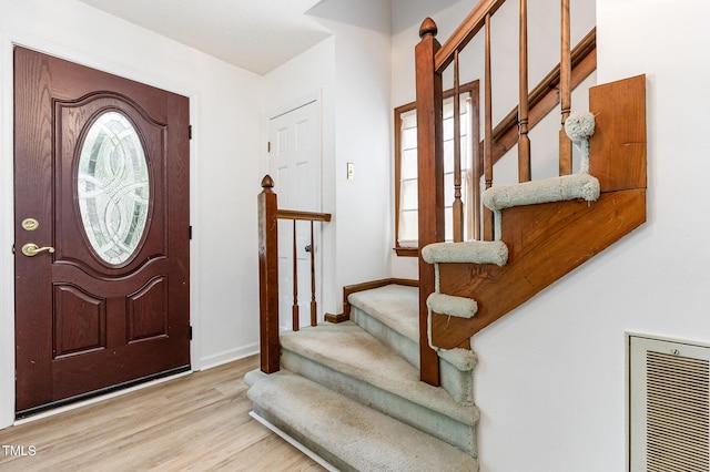 3605 Iron Sight Ct, Raleigh, NC 27616 - entrance foyer featuring stairway and wood finished floors