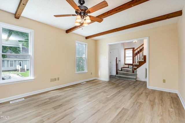 3605 Iron Sight Ct, Raleigh, NC 27616 - spare room with beamed ceiling, light wood-style floors, stairs, and ceiling fan