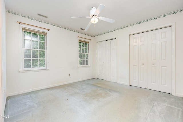 3605 Iron Sight Ct, Raleigh, NC 27616 - unfurnished bedroom featuring two closets, carpet, and multiple windows