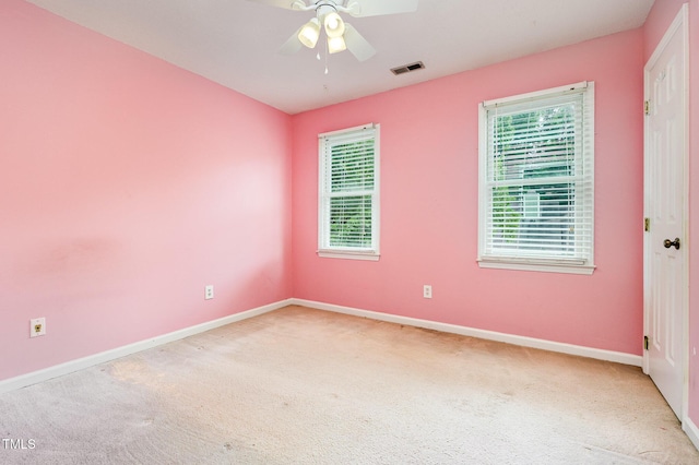3605 Iron Sight Ct, Raleigh, NC 27616 - empty room featuring healthy amount of natural light, light carpet, and a ceiling fan