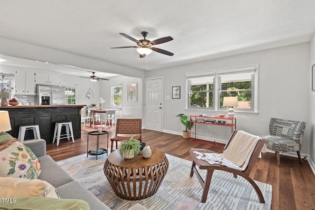 2322 Stroller Ave, Durham, NC 27705 - living area featuring ceiling fan and wood finished floors