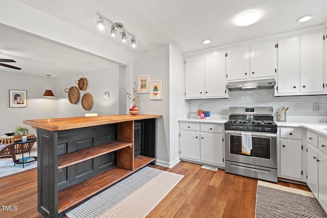 2322 Stroller Ave, Durham, NC 27705 - kitchen featuring stainless steel range with gas cooktop, under cabinet range hood, open shelves, white cabinetry, and recessed lighting