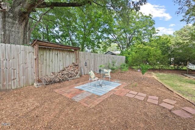 2322 Stroller Ave, Durham, NC 27705 - fenced backyard featuring a patio