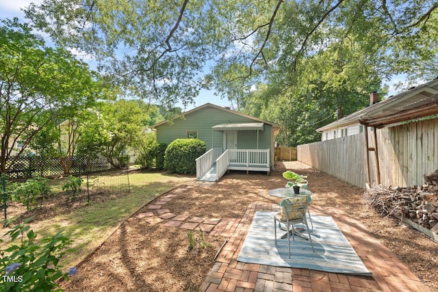 2322 Stroller Ave, Durham, NC 27705 - fenced backyard with a patio area and a deck