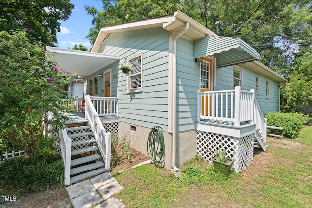 2322 Stroller Ave, Durham, NC 27705 - view of home's exterior with a porch, crawl space, and stairs