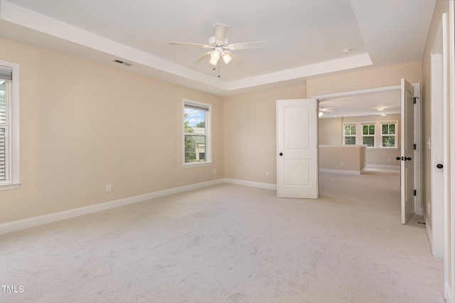 1304 Barnford Mill Rd, Wake Forest, NC 27587 - unfurnished room featuring ceiling fan, a raised ceiling, and light colored carpet