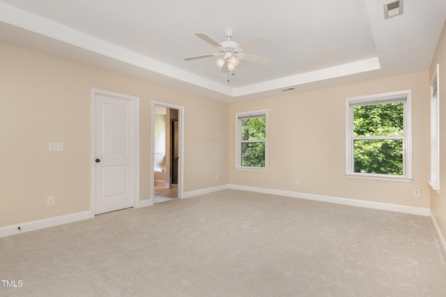 1304 Barnford Mill Rd, Wake Forest, NC 27587 - spare room featuring a raised ceiling, light carpet, and a ceiling fan