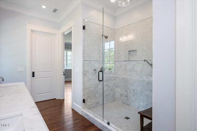 2508 Kearney Rd, Wake Forest, NC 27587 - full bathroom with wood finished floors, a shower stall, ornamental molding, double vanity, and recessed lighting