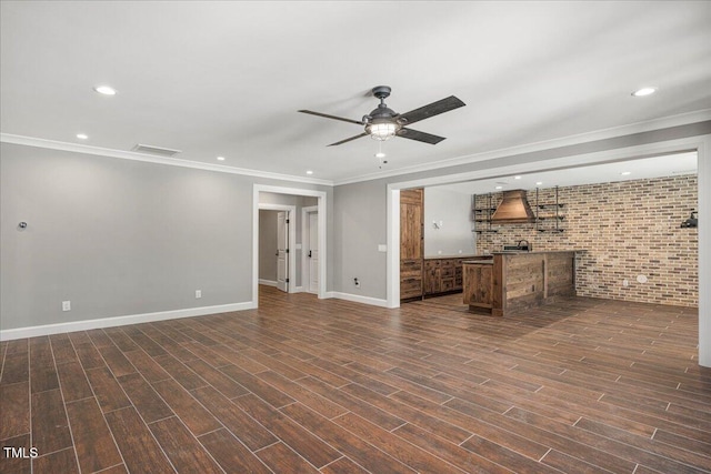 2508 Kearney Rd, Wake Forest, NC 27587 - unfurnished living room featuring brick wall, a ceiling fan, ornamental molding, recessed lighting, and dark wood-style floors
