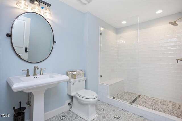 2508 Kearney Rd, Wake Forest, NC 27587 - bathroom featuring tiled shower, tile patterned floors, and recessed lighting
