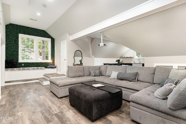 6313 Belle Crest Dr, Raleigh, NC 27612 - living area with wood finished floors, lofted ceiling, and recessed lighting