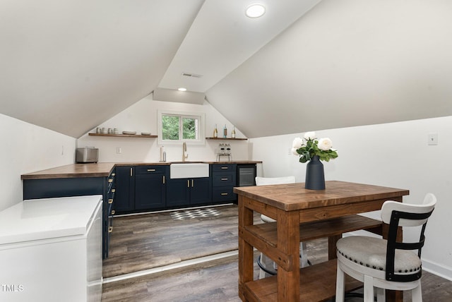 6313 Belle Crest Dr, Raleigh, NC 27612 - dining space featuring dark wood-style flooring, lofted ceiling, and recessed lighting