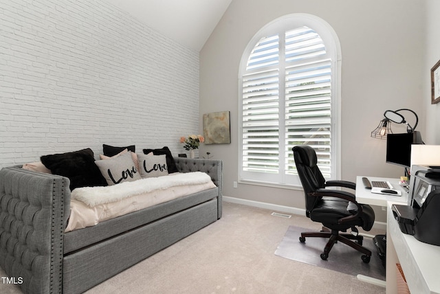 6313 Belle Crest Dr, Raleigh, NC 27612 - office area with vaulted ceiling, carpet, and brick wall