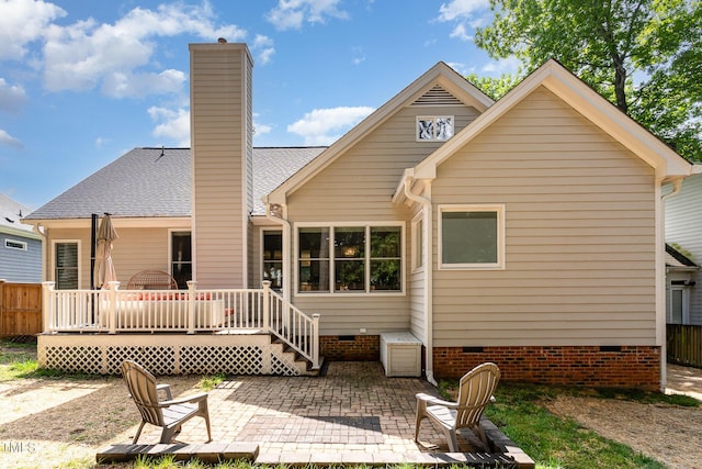 6313 Belle Crest Dr, Raleigh, NC 27612 - back of property featuring crawl space, a patio, a chimney, and a shingled roof