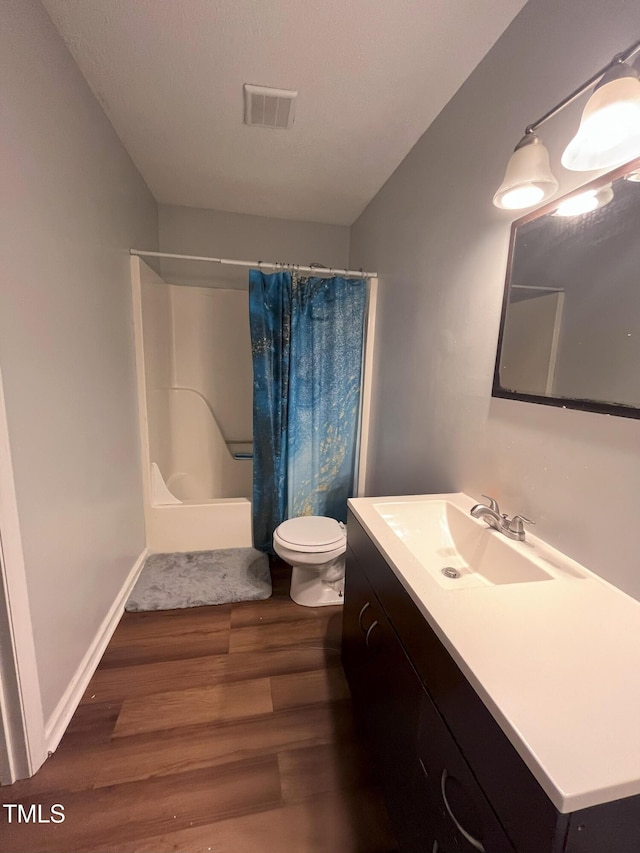 3624 Meadow Creek Ln, Raleigh, NC 27616 - full bath with wood finished floors, vanity, and shower / bath combination with curtain