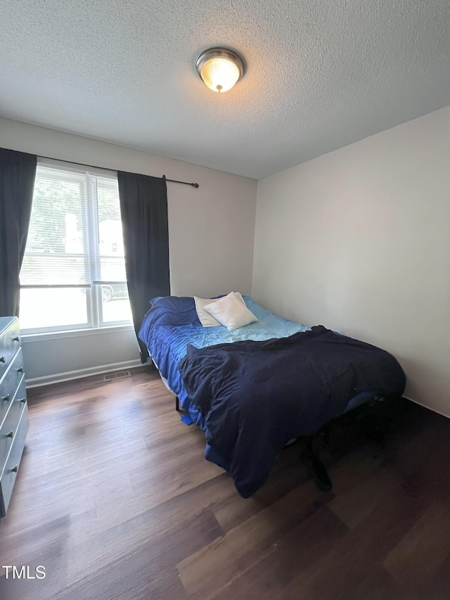 3624 Meadow Creek Ln, Raleigh, NC 27616 - bedroom featuring wood finished floors and a textured ceiling