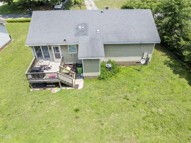 3624 Meadow Creek Ln, Raleigh, NC 27616 - rear view of house featuring a deck, a lawn, and roof with shingles