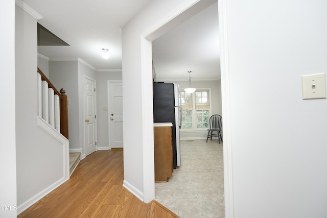 146 Greenmont Ln, Cary, NC 27511 - hall featuring stairway, ornamental molding, and light wood finished floors
