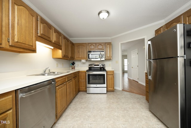 146 Greenmont Ln, Cary, NC 27511 - kitchen with stainless steel appliances, light countertops, brown cabinets, and crown molding