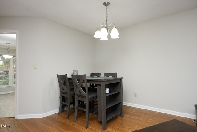 146 Greenmont Ln, Cary, NC 27511 - dining space featuring wood finished floors and a chandelier