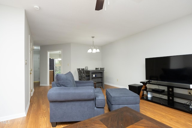 146 Greenmont Ln, Cary, NC 27511 - living area with wood finished floors, a chandelier, and ceiling fan