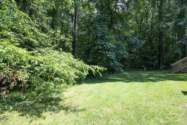 146 Greenmont Ln, Cary, NC 27511 - view of grassy yard with a forest view