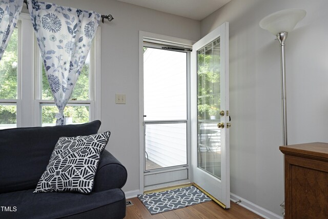 146 Greenmont Ln, Cary, NC 27511 - doorway to outside with healthy amount of natural light and wood finished floors