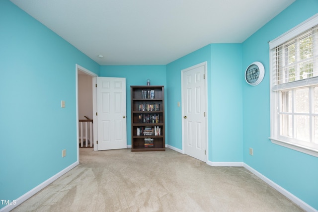 146 Greenmont Ln, Cary, NC 27511 - unfurnished bedroom featuring carpet floors and multiple windows