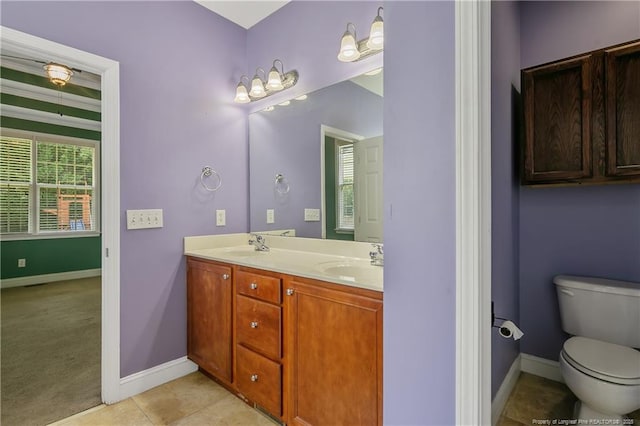 177 Lamplighter Way, Spring Lake, NC 28390 - full bathroom with double vanity, baseboards, toilet, and tile patterned floors