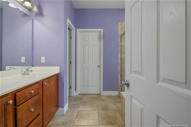 177 Lamplighter Way, Spring Lake, NC 28390 - bathroom with an enclosed shower, vanity, and baseboards