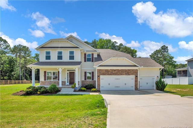 66 S Hawks Ridge Ln, Smithfield, NC 27577 - craftsman house featuring an attached garage, a porch, concrete driveway, and stone siding