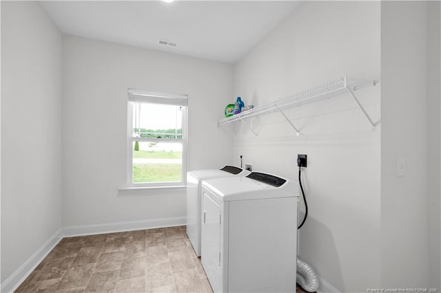66 S Hawks Ridge Ln, Smithfield, NC 27577 - laundry area with washer and clothes dryer and baseboards