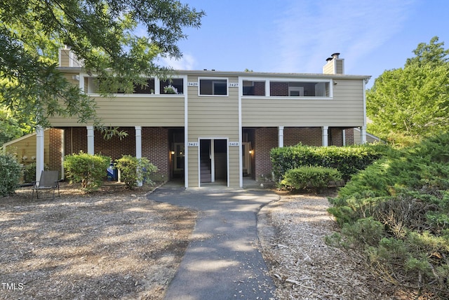 3427 Mill Run, Raleigh, NC 27612 - view of front of house featuring a chimney and brick siding