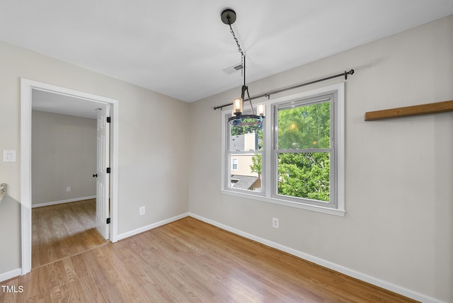 3427 Mill Run, Raleigh, NC 27612 - empty room featuring light wood finished floors and baseboards