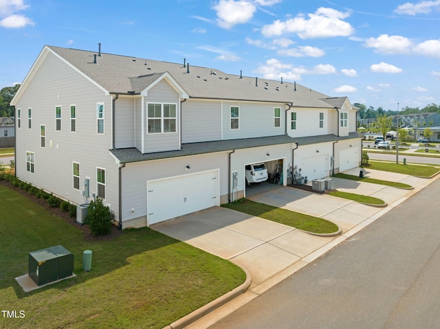 364 Abbots Mill Dr, Raleigh, NC 27603 - view of front of house with an attached garage, roof with shingles, concrete driveway, a front lawn, and a residential view